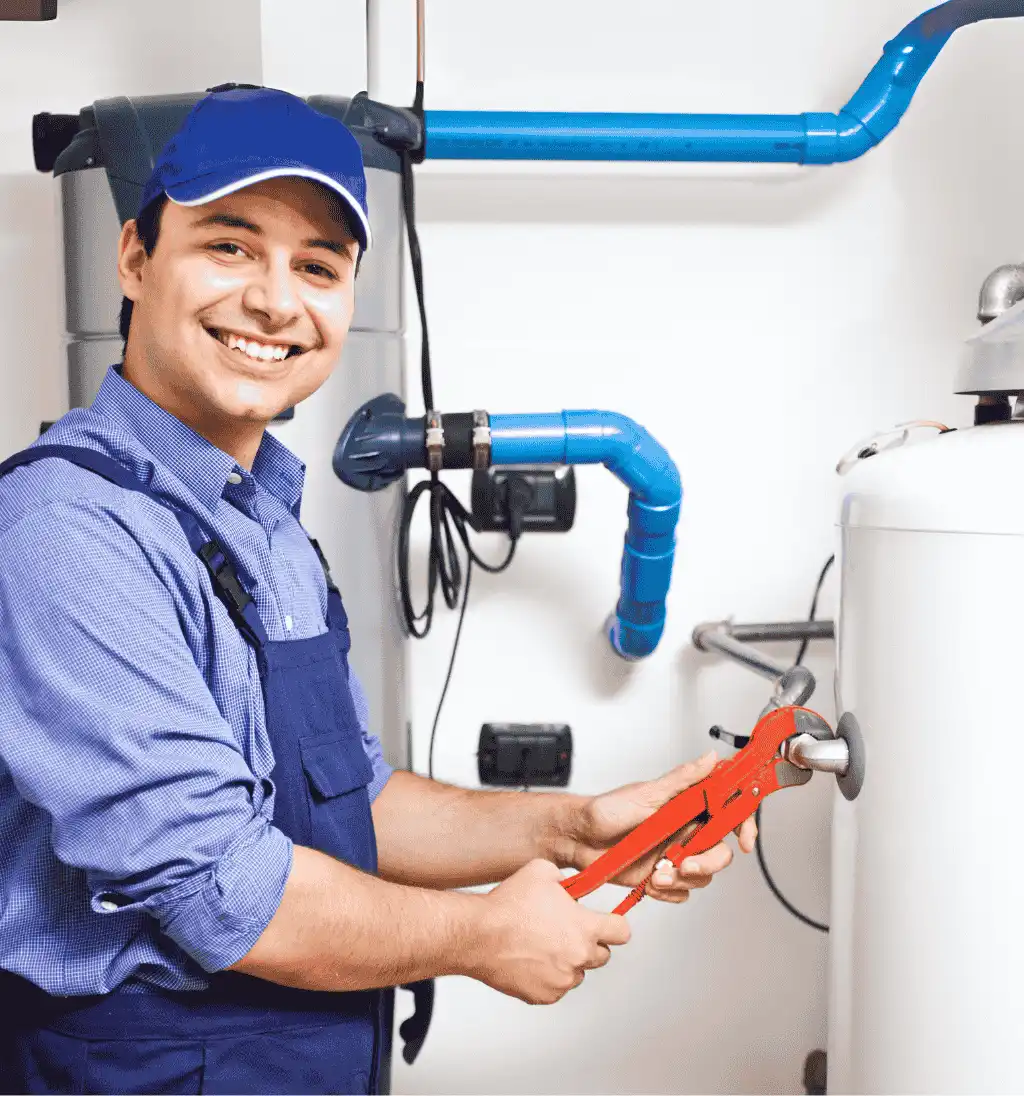 Plumber adjusting water heater settings during maintenance